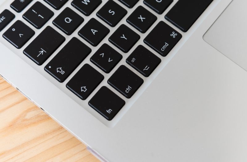 laptop keyboard on wooden table